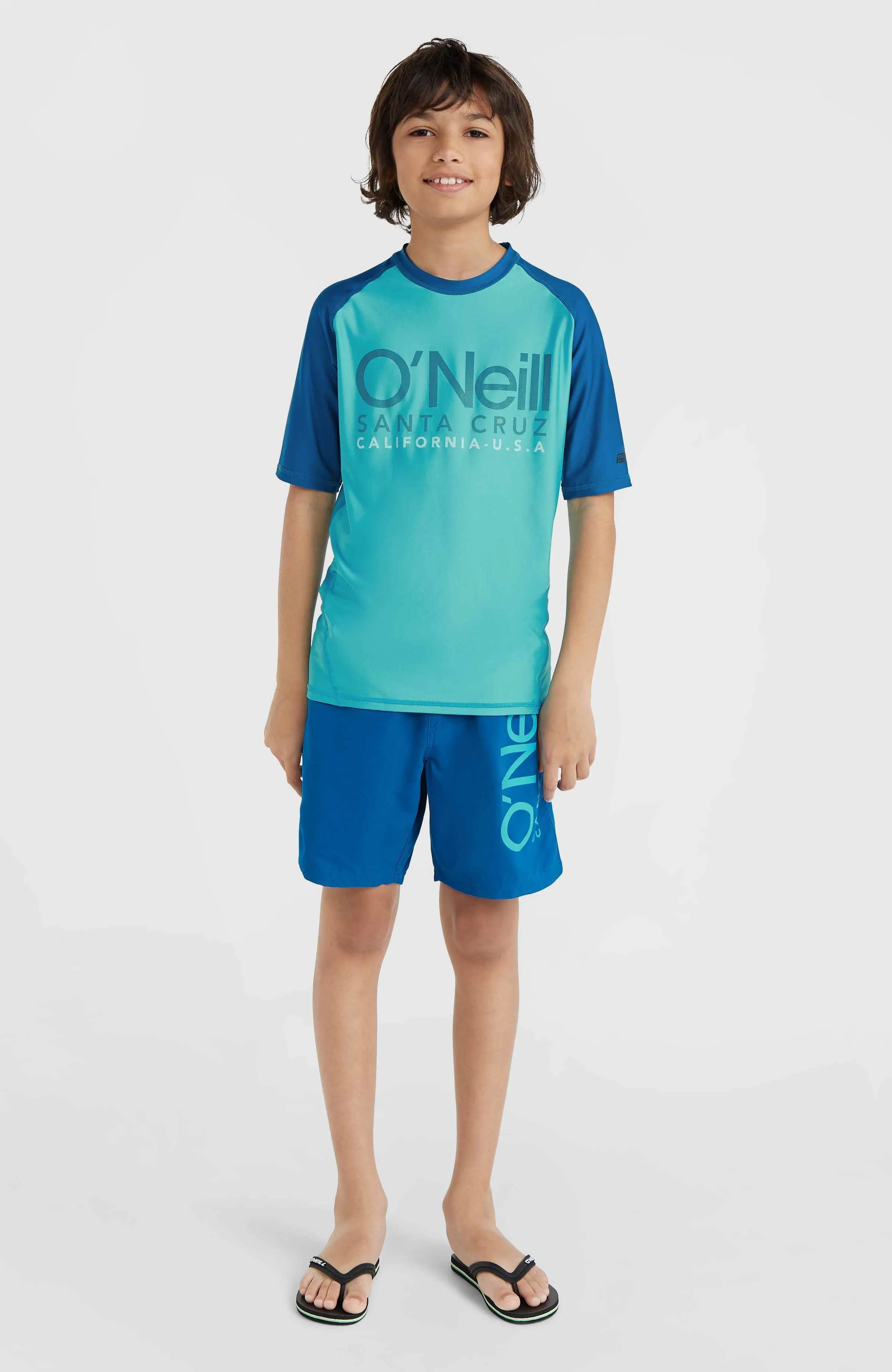 Essentials Cali Short Sleeve Skin | Neon Blue