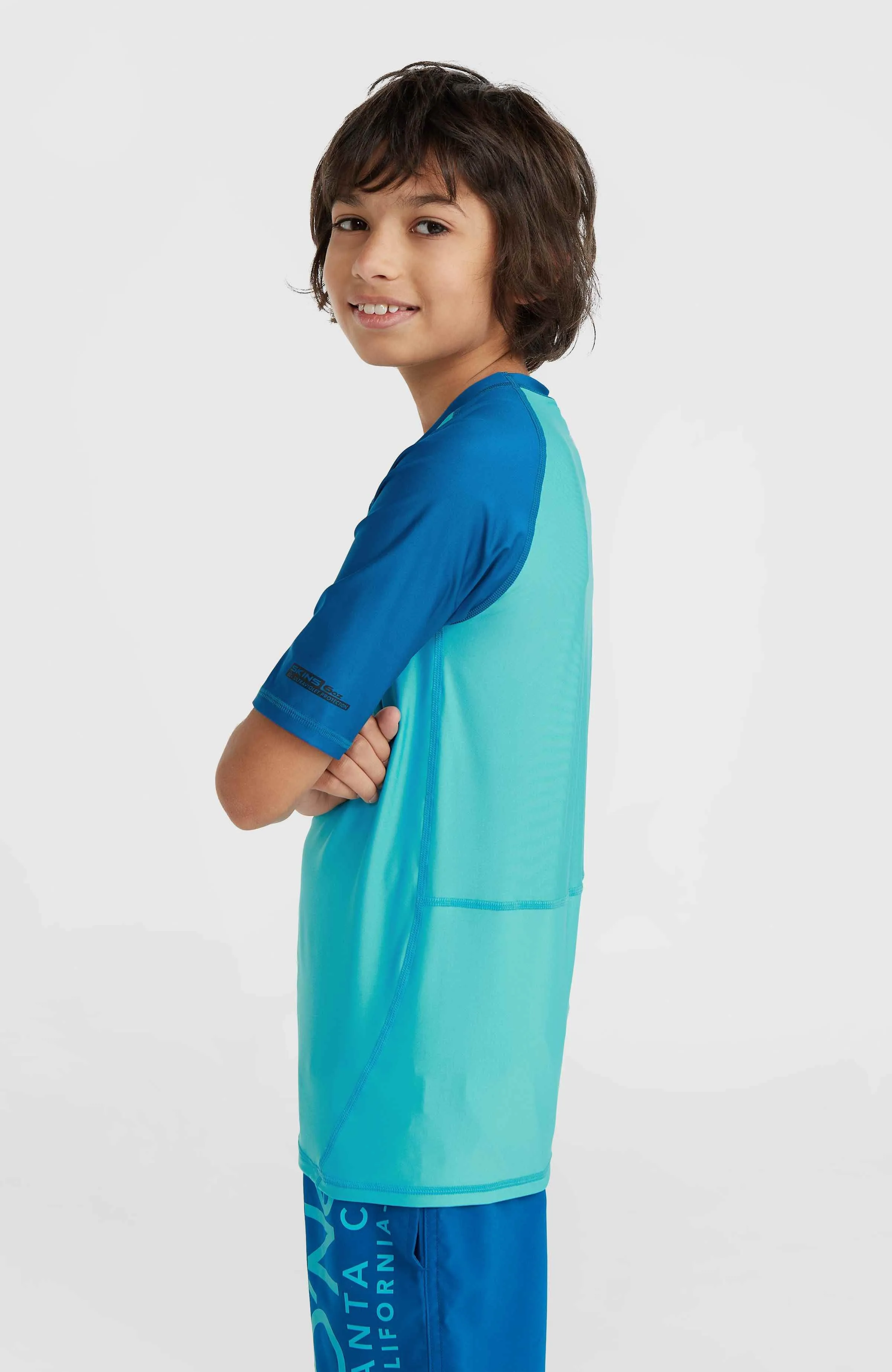 Essentials Cali Short Sleeve Skin | Neon Blue